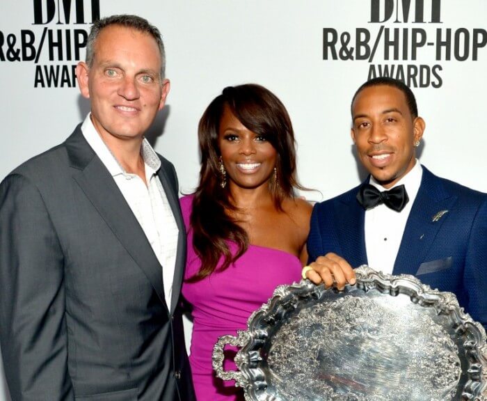 BMI President and CEO Michael O'Neill, BMI Vice President of Writer/Publisher Relations Catherine Brewton and honoree Chris 'Ludacris' Bridges (holding the BMI President's Award) attend the 2014 BMI R&B/Hip-Hop Awards at the Pantages Theatre on August 22, 2014 in Hollywood, California. Photo: Lester Cohen