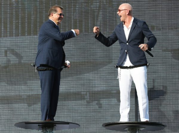 Pitbull and Frank Del Rio celebrating with a fist bump at Norwegian Escape christening ceremony