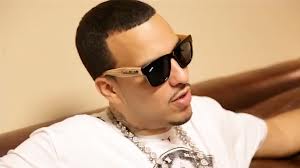 French Montana posing with his debut  'Excuse My French'