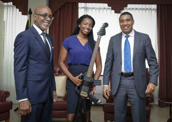 Image of Jamaican Prime Minister Andrew Holness with Niambe McIntosh and Chairman of Pulse Kingsley Cooper