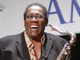 Clarence Clemons playing saxophone, supporting Little Kids Rock