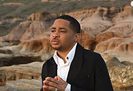 Smokie Norful alongside the McDonald's logo